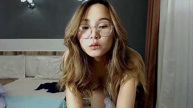 Jin-Ae naked stripping on cam for live sex video chat